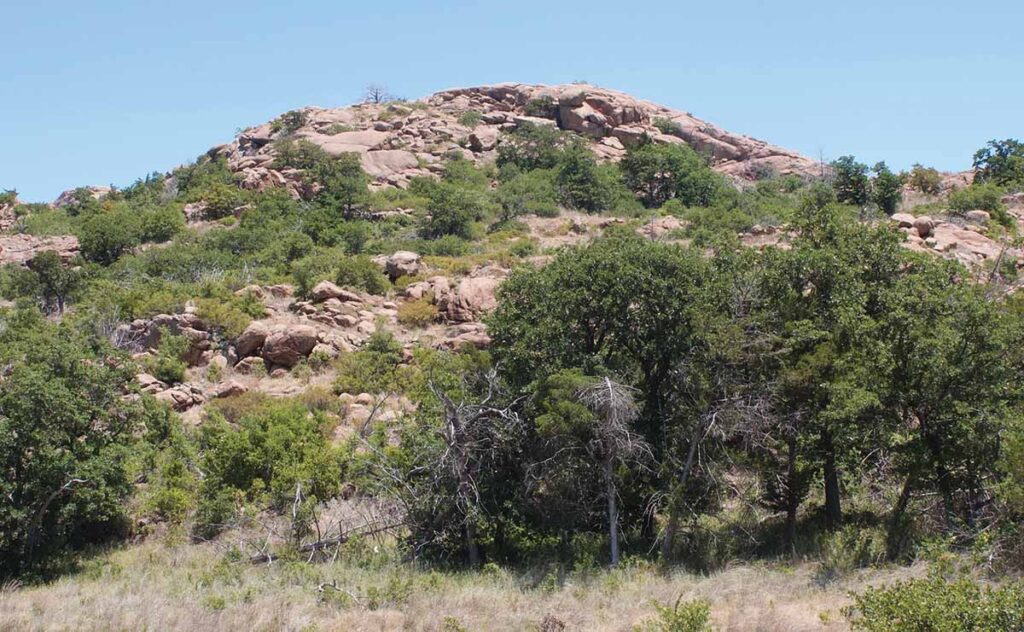 The Wichita Mountains stand in stark contrast to the Oklahoma prairie.The Wichita Mountains stand in stark contrast to the Oklahoma prairie.